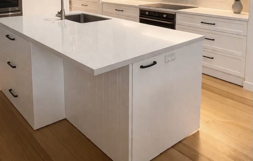 Completed modern kitchen with white stone island benchtop